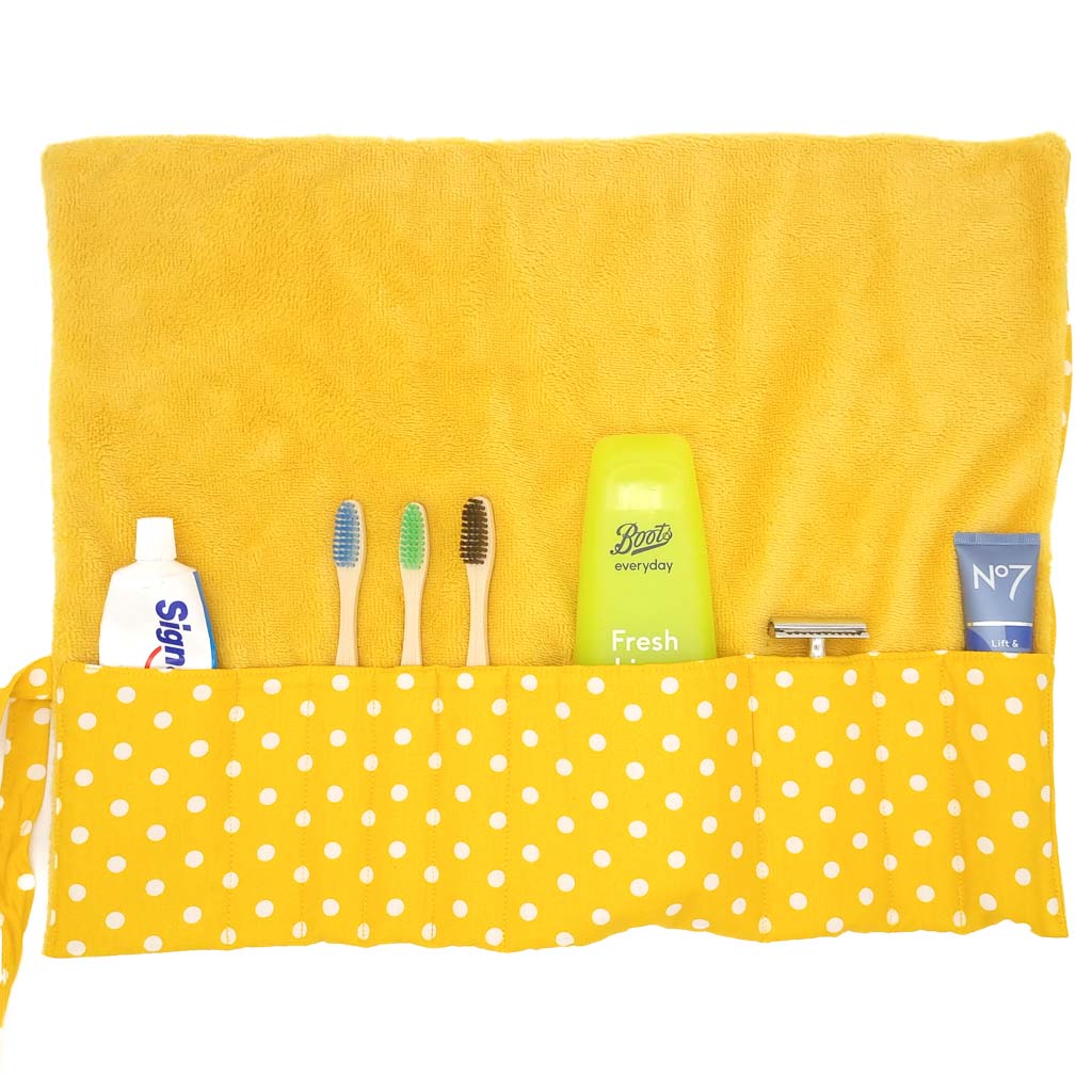 Yellow spotty toiletry bag with a bamboo towelling lining