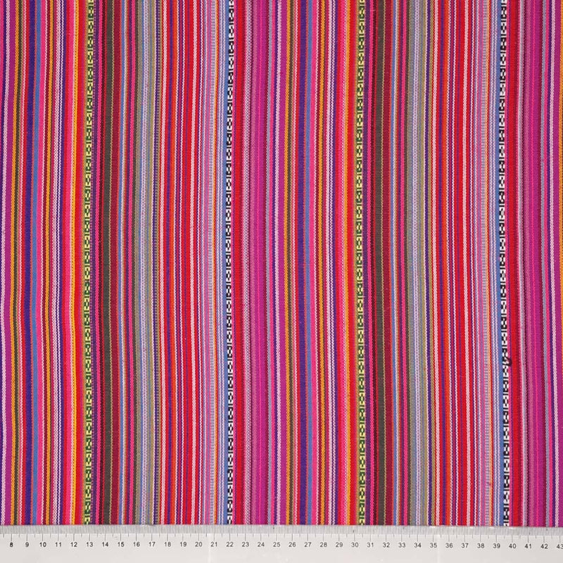 A mexico stripe in fuchsia pink printed on a woven polyester fabric with a cm ruler