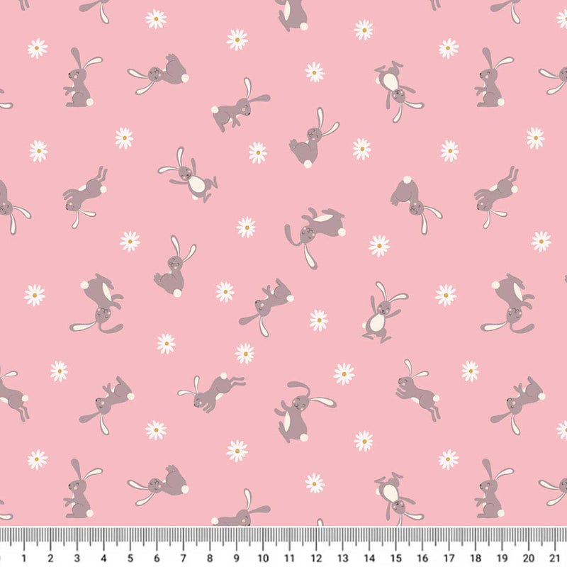 Cute little Easter bunnies are printed on a pink 100% premium quilting cotton with a cm ruler