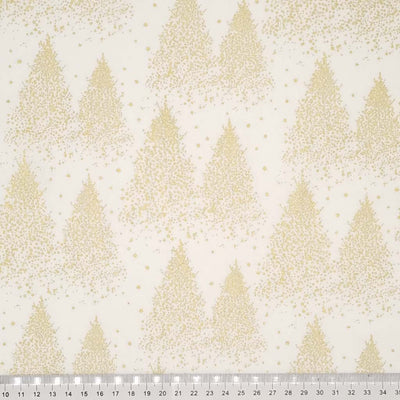 A Christmas tree design that is made entirely of clustered gold dots to create a frosty, wintery forest pattern printed on a cream 100% cotton fabric with a cm ruler