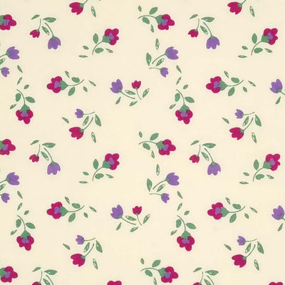 Bright cerise and purple tulip flowers are printed on a cream polycotton fabric