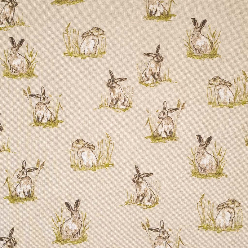 Hares in grassy patches printed on a panama linen look fabric