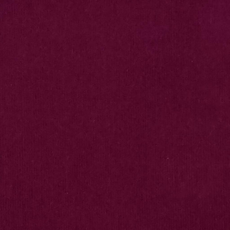 A wine coloured plain needlecord corduroy fabric