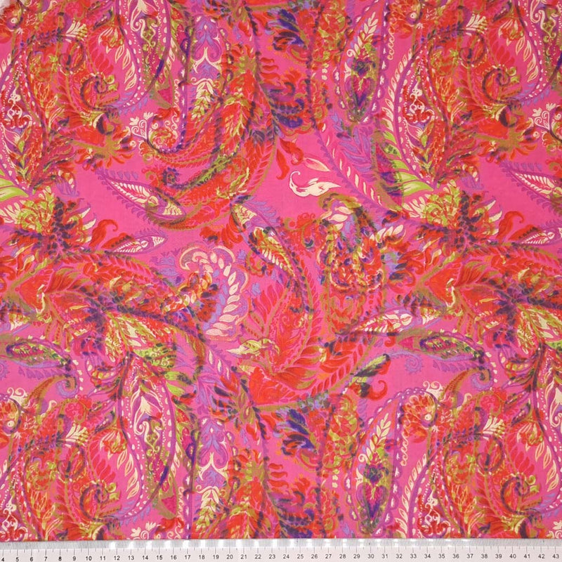 Pink paisley pima cotton lawn fabric with a cm ruler