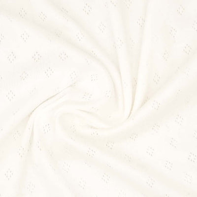 A pointelle stretch jersey fabric in cream