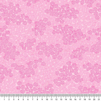 Pink ditsy spots and hearts are printed on a cotton quilting fabric