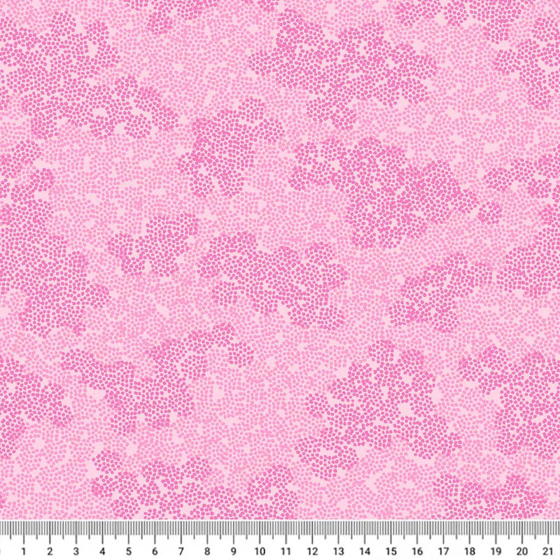Pink ditsy spots and hearts are printed on a cotton quilting fabric
