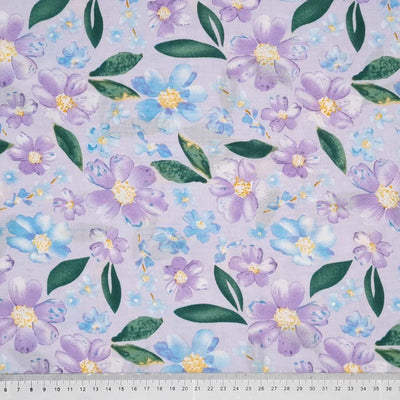 Pretty blue coloured flowers are printed on a quality woven viscose fabric with a cm ruler