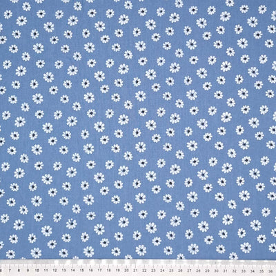 Vintage daisies printed on an airforce blue washed cotton fabric with a cm ruler