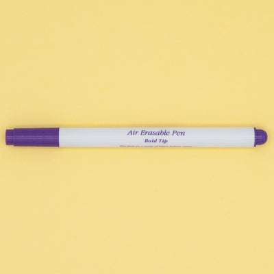 A purple and white bold tipped air drying fabric marker