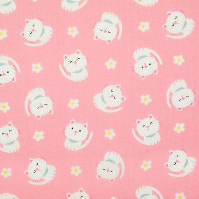 White cats with little daisies are printed on a pink polycotton fabric
