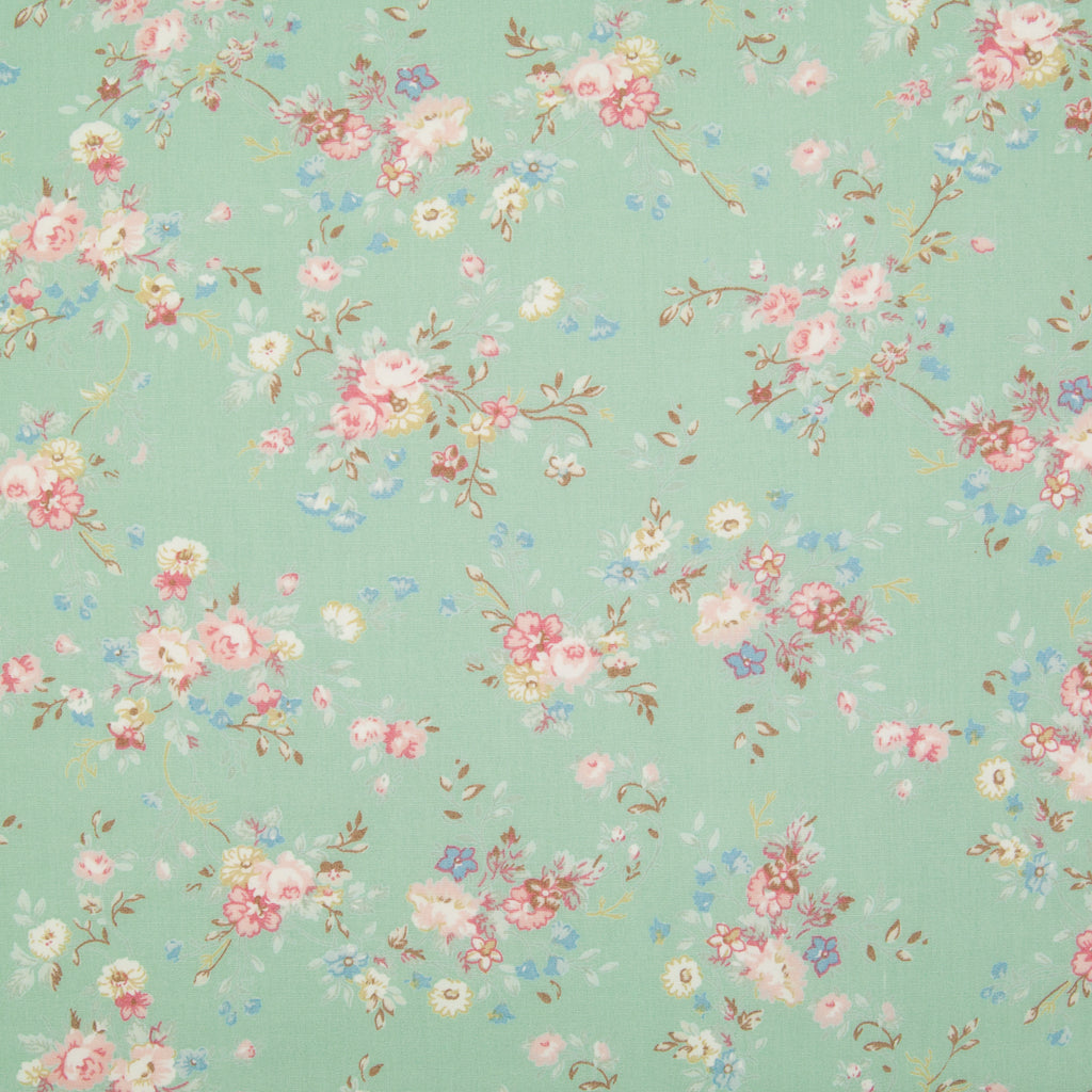 A beautiful, delicate floral print by Rose and Hubble printed on meadow green cotton poplin fabric