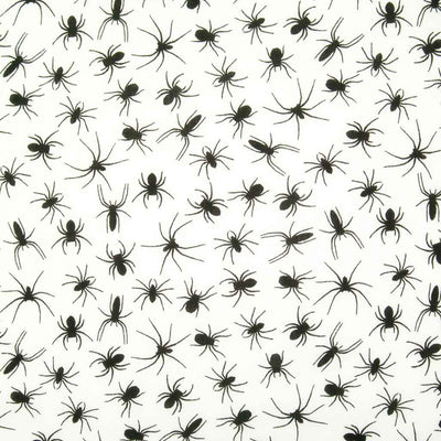 Black spiders printed on a white polycotton halloween fabric