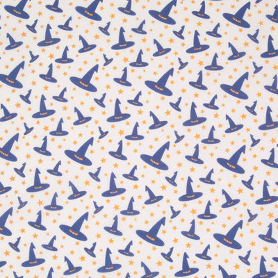 Jaunty purple witches' hats printed on a white polycotton fabric.