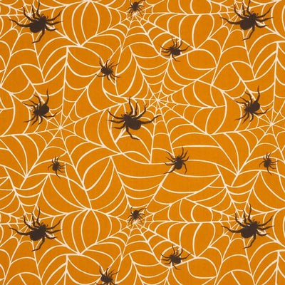 Hairy spiders guarding their webs are printed on an orange polycotton fabric. 