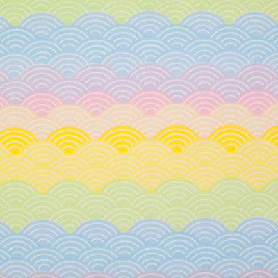 Pastel coloured rainbow arches printed on a fat quarter of polycotton fabric