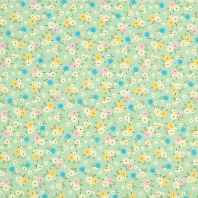 Tiny bunches of pink, blue and yellow flowers on a meadow green Rose and Hubble cotton poplin fabric