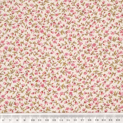Tiny pink flowers printed on a cotton poplin fabric