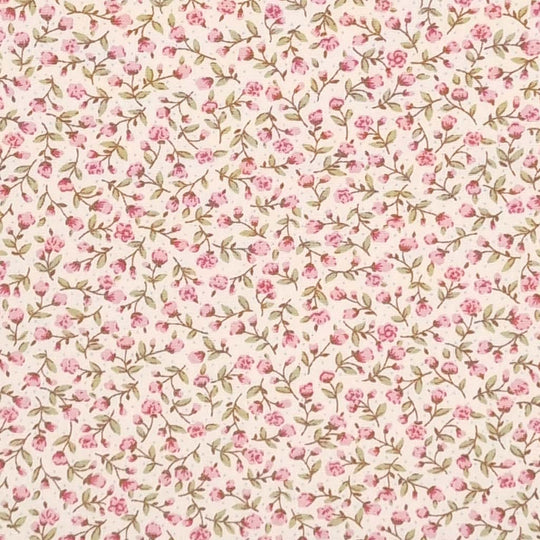A ditsy pink floral pattern is printed on a cream Rose & Hubble cotton poplin fabric
