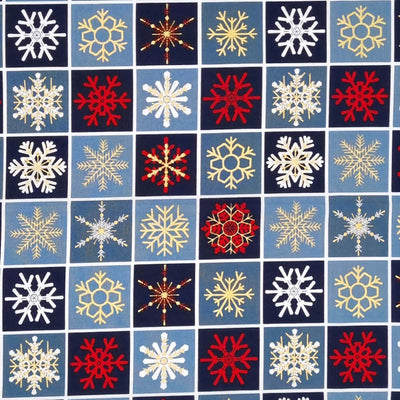 Printed gold, red and white metallic snowflakes are printed on this navy checkboard style 100% cotton fabric. 
