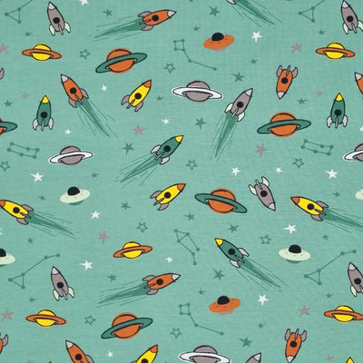 Flying space rockets printed on a green cotton jersey fabric