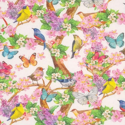Colourful birds, butterflies and flowers printed on a white cotton fabric