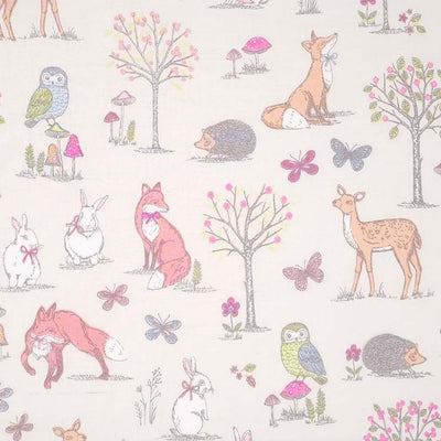An endearing woodlland scene featuring owls, rabbits, foxes and hedgehogs, all printed on a cream, 100% cotton fabric