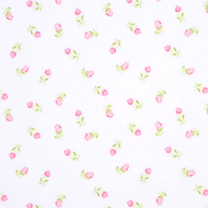 A delicate pink baby rose is printed on a white polycotton fabric with a cm ruler
