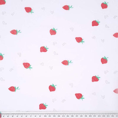 Luscious red strawberries and heart shaped balloons are printed on a quality lilac polycotton fabric with a cm ruler