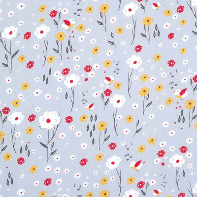 Flowers and happy singing birds are printed on a grey polycotton fabric. 
