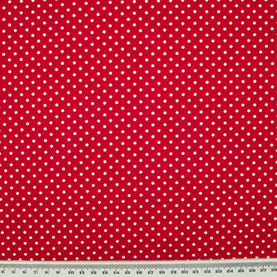 white spots on a red fabric