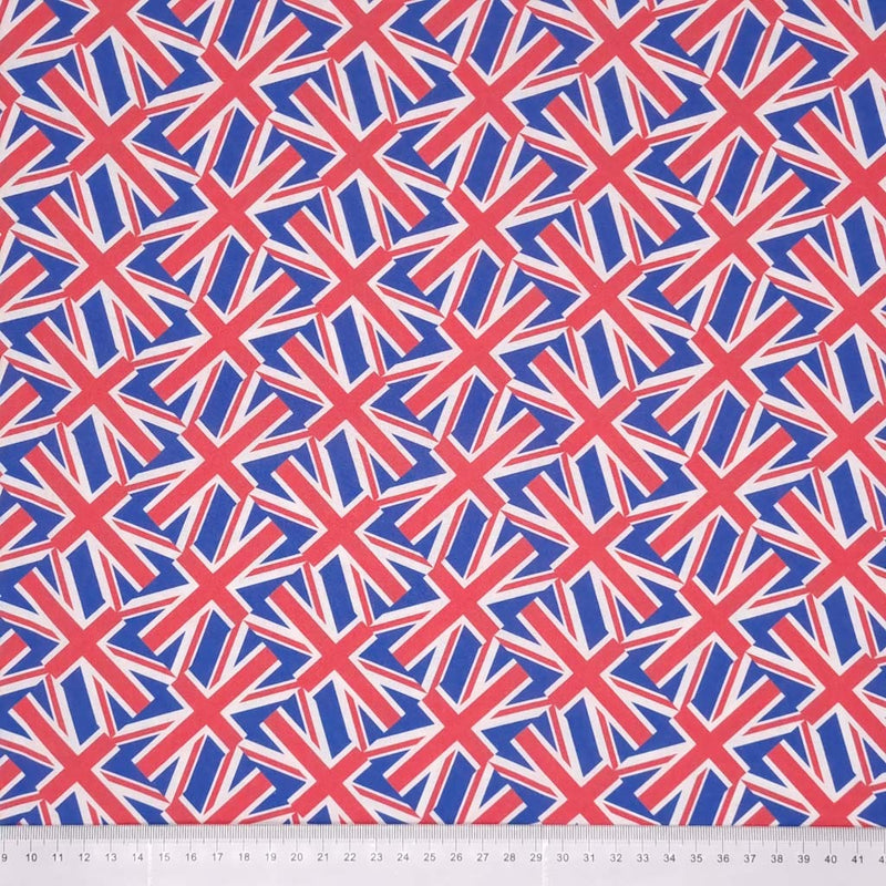 Small tossed union jack flags printed on a 100% cotton fabric with a cm ruler at the bottom