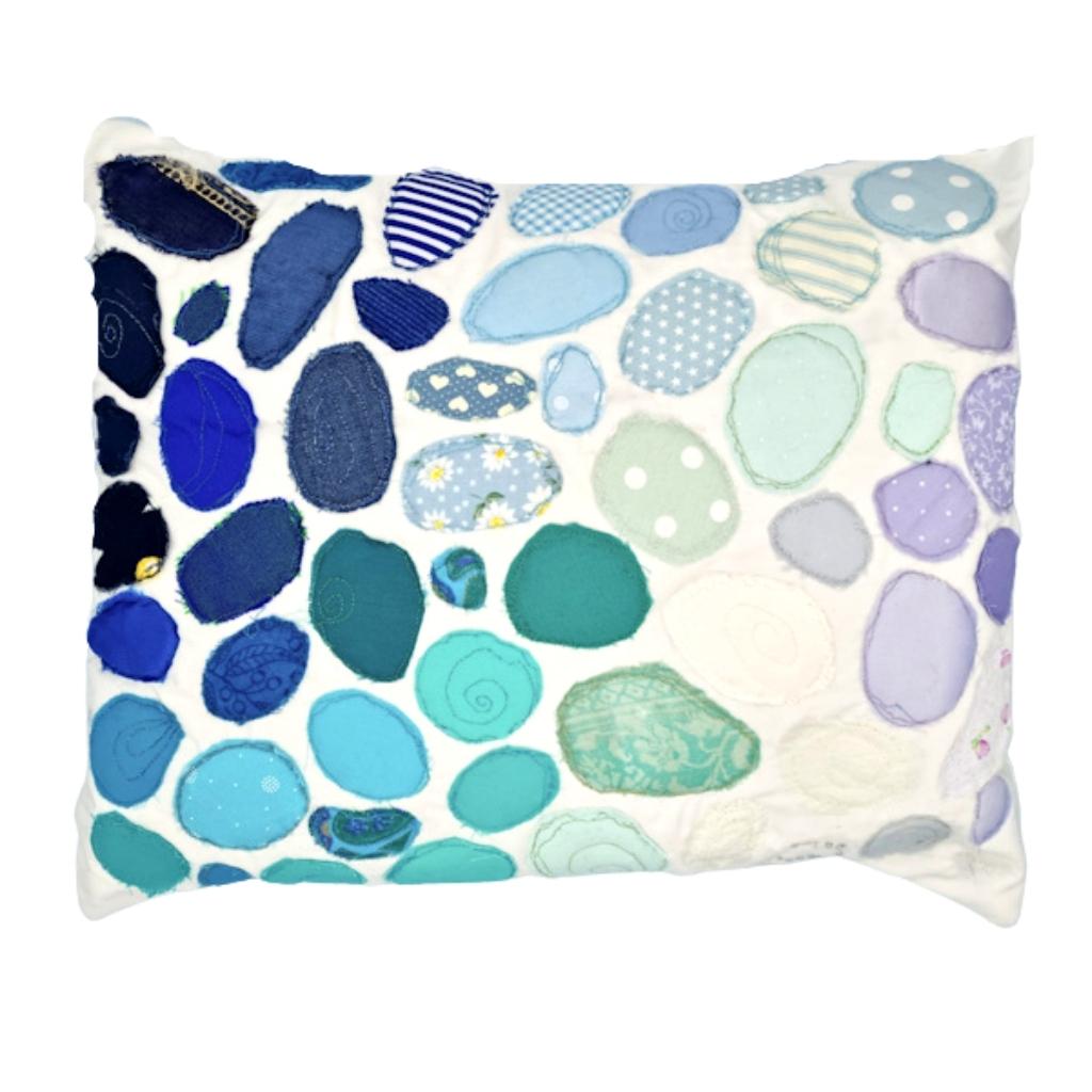 A cushion made with sea glass quilting