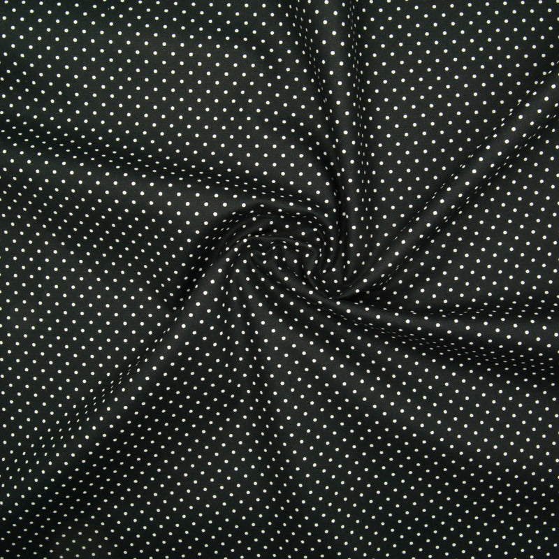 White pin spots printed on black cotton poplin fabric