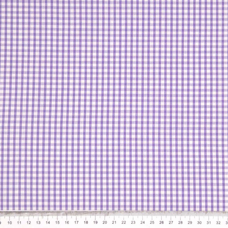 Corded polycotton gingham in a 1/8" check in lilac with a cm ruler