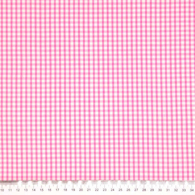 Corded polycotton gingham in a 1/8" check in pink with a cm ruler