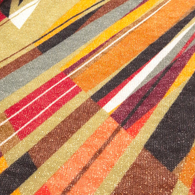 Close up of abstract argyle print with glitter on a stretch fabric