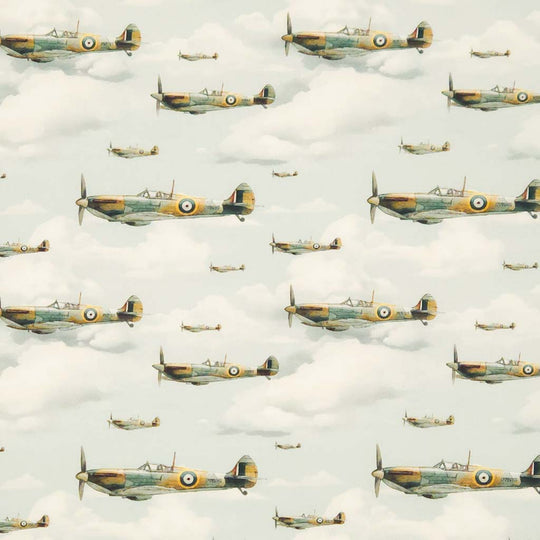 Pattern of vintage airplanes flying through clouds on a light blue cotton poplin fabric