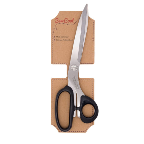 SewCool multi-use scissors with black handles and stainless steel blades, presented in a brown cardboard holder on a white background.