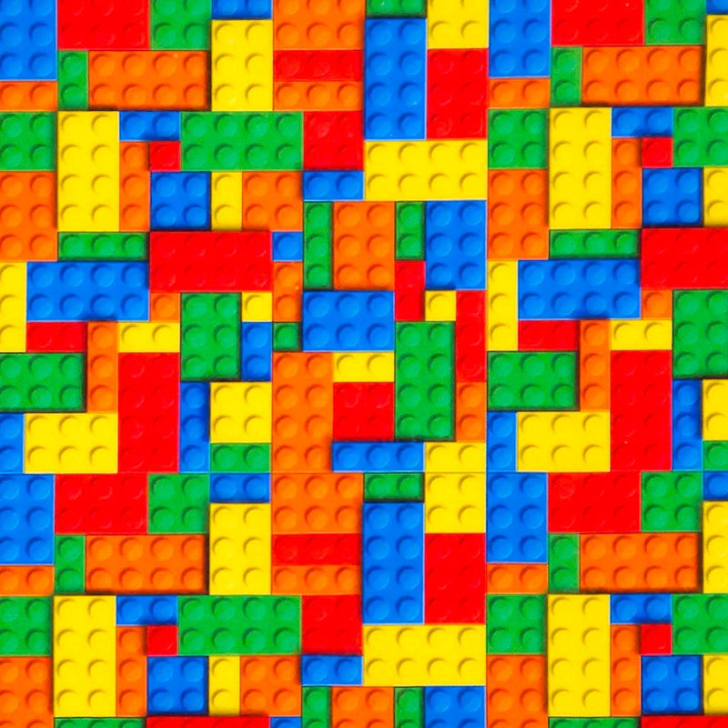 Pattern of colourful building blocks in red, orange, yellow, green, blue, and purple printed on a cotton fabric.