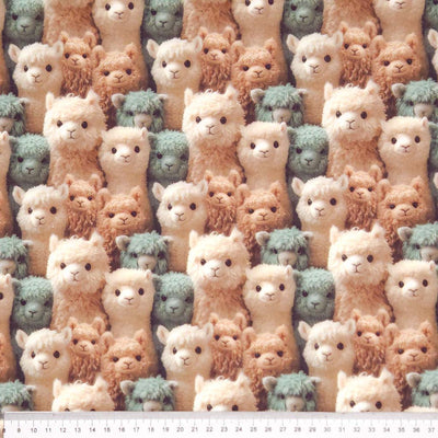 Pattern of plush alpaca toys in various colours printed on a cotton fabric by Little Johnny with a cm ruler
