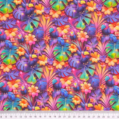 Colorful tropical leaf and flower pattern with purple birds printed on a cotton fabric by Little Johnny