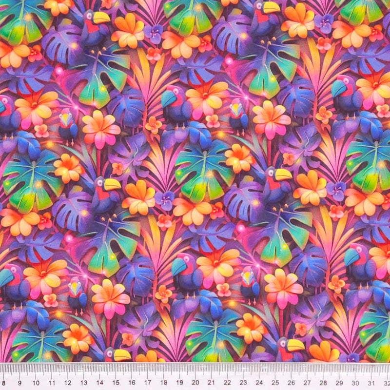 Colorful tropical leaf and flower pattern with purple birds printed on a cotton fabric by Little Johnny