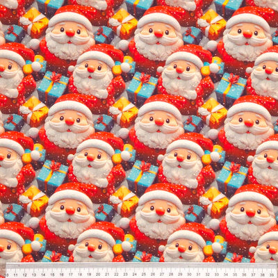 Pattern of Santa Claus and presents with a ruler at the bottom for scale.