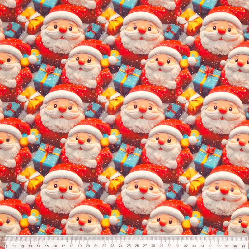 Pattern of Santa Claus and presents with a ruler at the bottom for scale.
