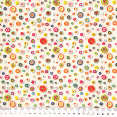 3D applique spots are printed on a cream cotton fabric by Little Johnny with a cm ruler