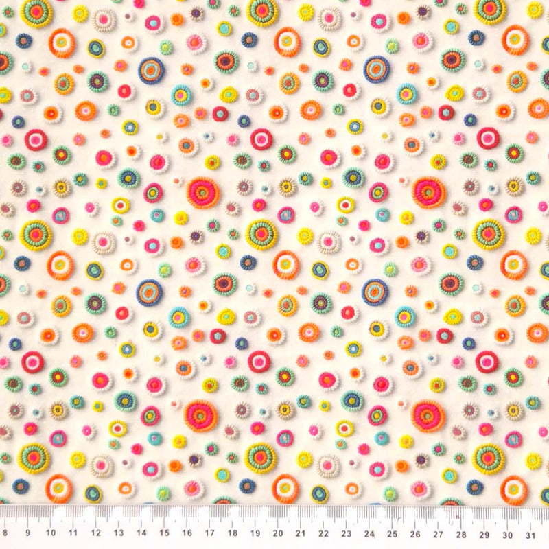 3D applique spots are printed on a cream cotton fabric by Little Johnny with a cm ruler