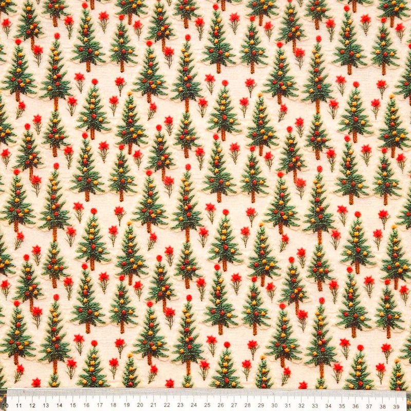 3D christmas trees printed on a cream cotton fabric with a cm ruler