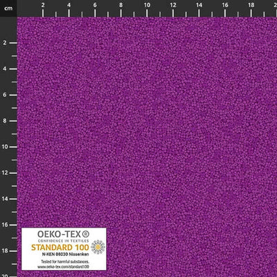 Stof Brighton cotton blender quilting fabric in purple with a ruler