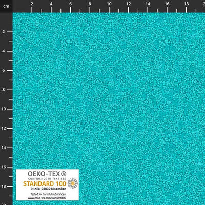 Stof Brighton cotton blender quilting fabric in turquoise with a ruler